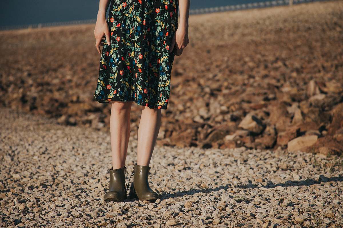 evening dress woman standing on gravel wearing floral dress person